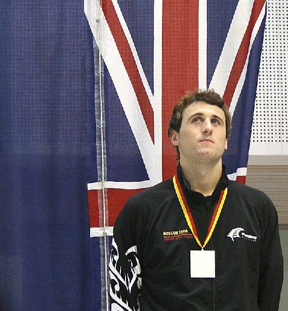 New Zealand's Andy McMillan is presented with his silver medal at the world lifesaving championships in Germany, after breaking Trent Bray's long-standing 200m obstacles NZ record.